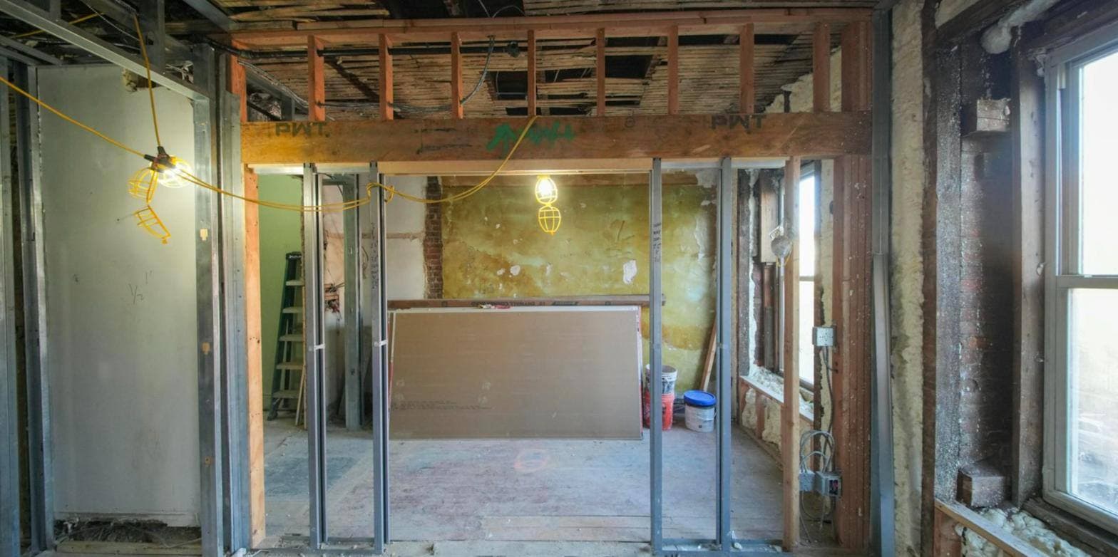 Interior renovation in progress with new steel stud framing